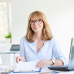 Custom Readers on woman in office working at desk